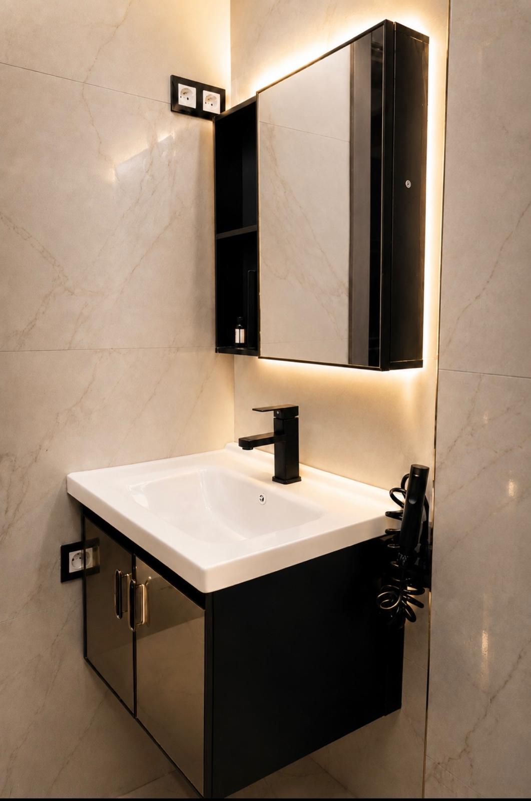 Wall-hung basin and backlit mirror